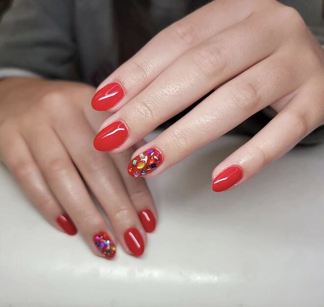 Classic red with a confetti accent nail