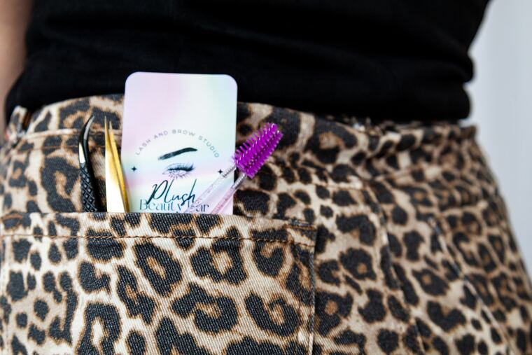 Alyssa's Plush Beauty Bar card and lash tools tucked in her pocket