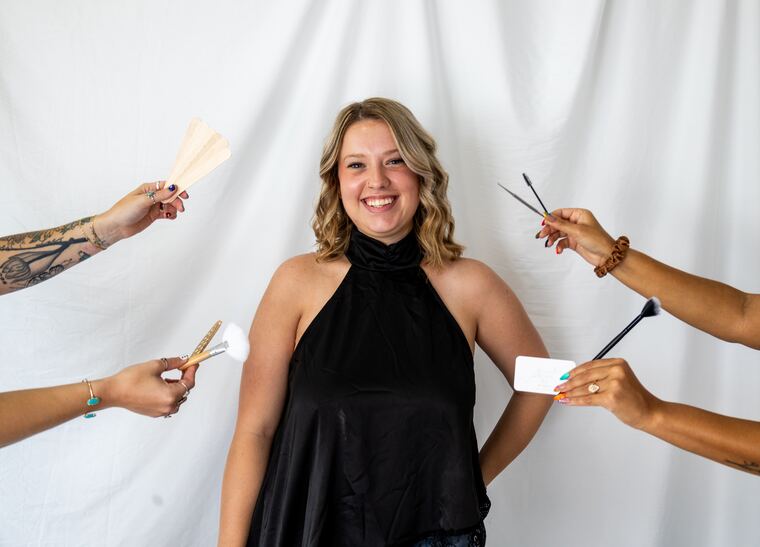 Brynn surrounded by brushes and brow tools