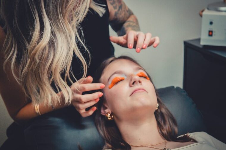 Kyndal prepping a client for a lash lift